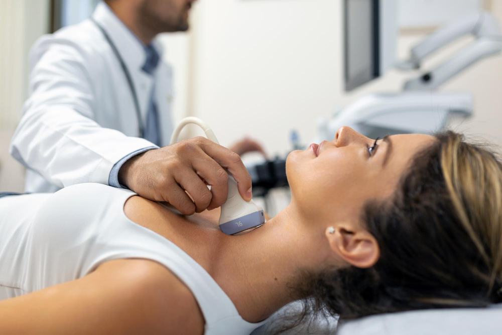 close-up-shot-of-young-woman-getting-her-neck-examined-by-doctor-using-ultrasound-scanner-at-modern-clinic